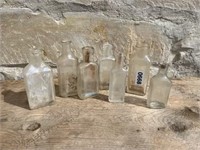 (7) COLLECTION OF ANTIQUE SMALL CORK TOP BOTTLES