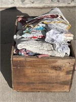 (1) RUSTIC WOOD BOX FILLED W/ DOOLIES, FABRIC, ETC