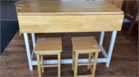 Drop leaf breakfast table and 2 stools, light