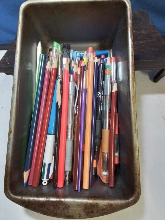 Loaf pan of pins and pencils
