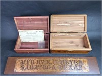 Two Cedar Boxes and a Sign