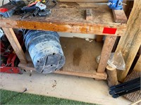 Wooden workshop bench with vise