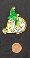 Unique vintage brooch of man on cycle made in