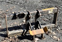 Auger powerhead cradle skid loader mount -