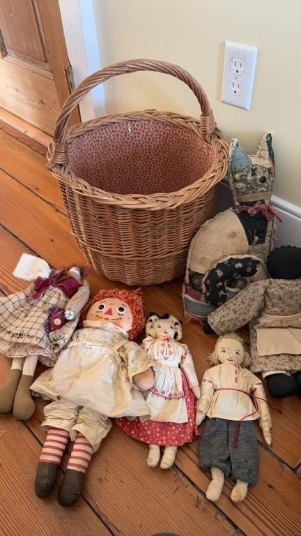 Basket with five cloth dolls, including a vintage