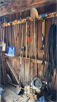 Hand tools hanging up, left side of cabin,