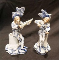 Pair of figural candleholders
