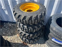(4) 10-16.5 Skid Steer Tires on Yellow Wheels