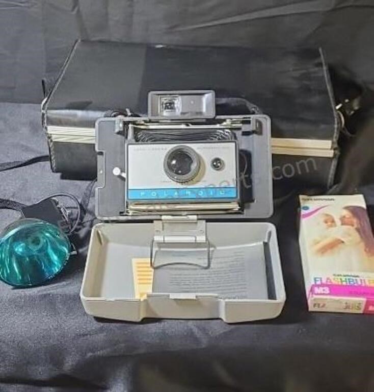 Vintage Polaroid Land camera with flashbulbs and
