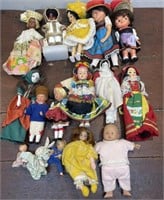Box of vintage small dolls