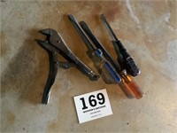 Vice grips, and three screwdrivers