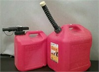 2 5 Gallon Gas Cans With Nozzles, 1 Has some Gas