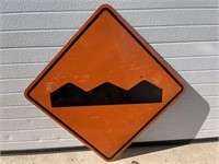 Road sign- Orange bumpy road