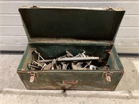 Green tool box full of c-clamps