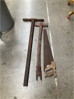 2 wagon handles and saw