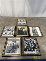 Signed black and white Green Bay Packer photos.