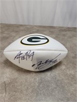 Aaron Rodgers and Nick Barnett signed Wilson white