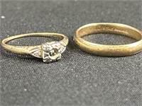 Both rings marked 14 karat. The men’s ring is