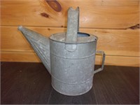 old watering can garden