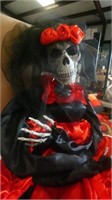 Skeleton in red and black dress
