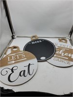 3 circular wooden decor signs