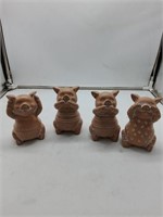 4 mini pig statues