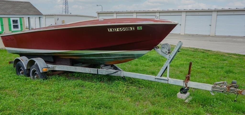 Moving trucks and Chris Craft boat