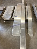 4 piles of assorted aluminum sheet strips