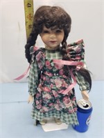 Porcelain doll with braids with floral dress