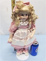 Porcelain doll with pink dress