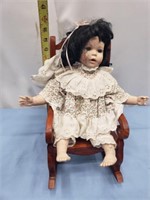 Porcelain baby doll and rocker