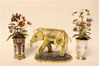 A Brass Elephant and Two Enamel Flowers on Porcela