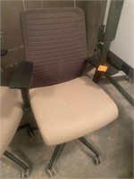 Tan cloth office chair with adjustable arms mobile