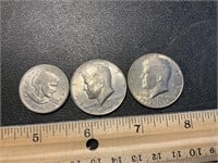 2 Kennedy half dollars and a Susan B Anthony