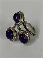 Sterling silver ring set w/ 3 purple cabochon