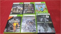 6 xbox 360 games in the case