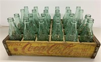 Collection 24 vintage Coca Cola bottles & crate -