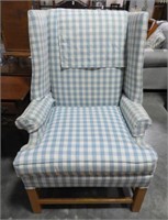 Blue and white plaid upholstered wing chair