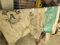 3 vintage seed sacks.