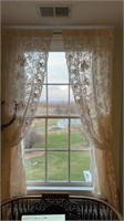 Pair of white lace curtains, with intricate