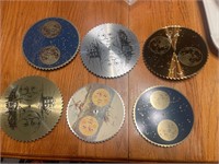 Six decorative sawblade clock face parts