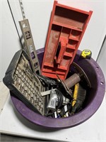 Purple utility bucket full of tools