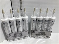 8 tubes of ivory acrylic caulking