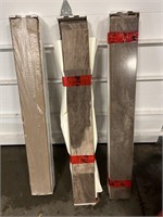 3 stacks of laminate flooring