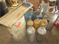 6 PROPANE CYLINDERS, 3 TRASH CANS