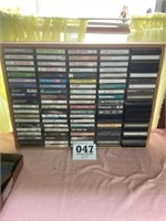 Lot of old cassettes and storage shelf
