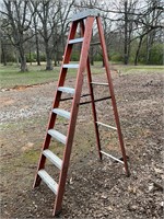 Louisville 7 ft ladder. One hinge has a pipe brace