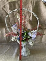 Vintage tall flower basket with flowers