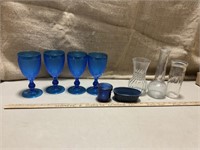 Blue plastic cups and glass vases