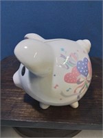 White ceramic piggy bank with hearts
